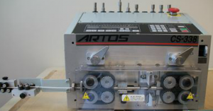 Close-up of an ARTOS industrial machine with visible gears and control panel.