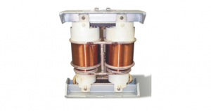 Copper coil transformer with white mounts and metal frame.