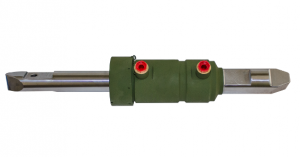 Close-up of a green hydraulic cylinder with a metal rod and red fittings.